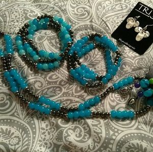 A necklace and earrings with to Affinity bracelets