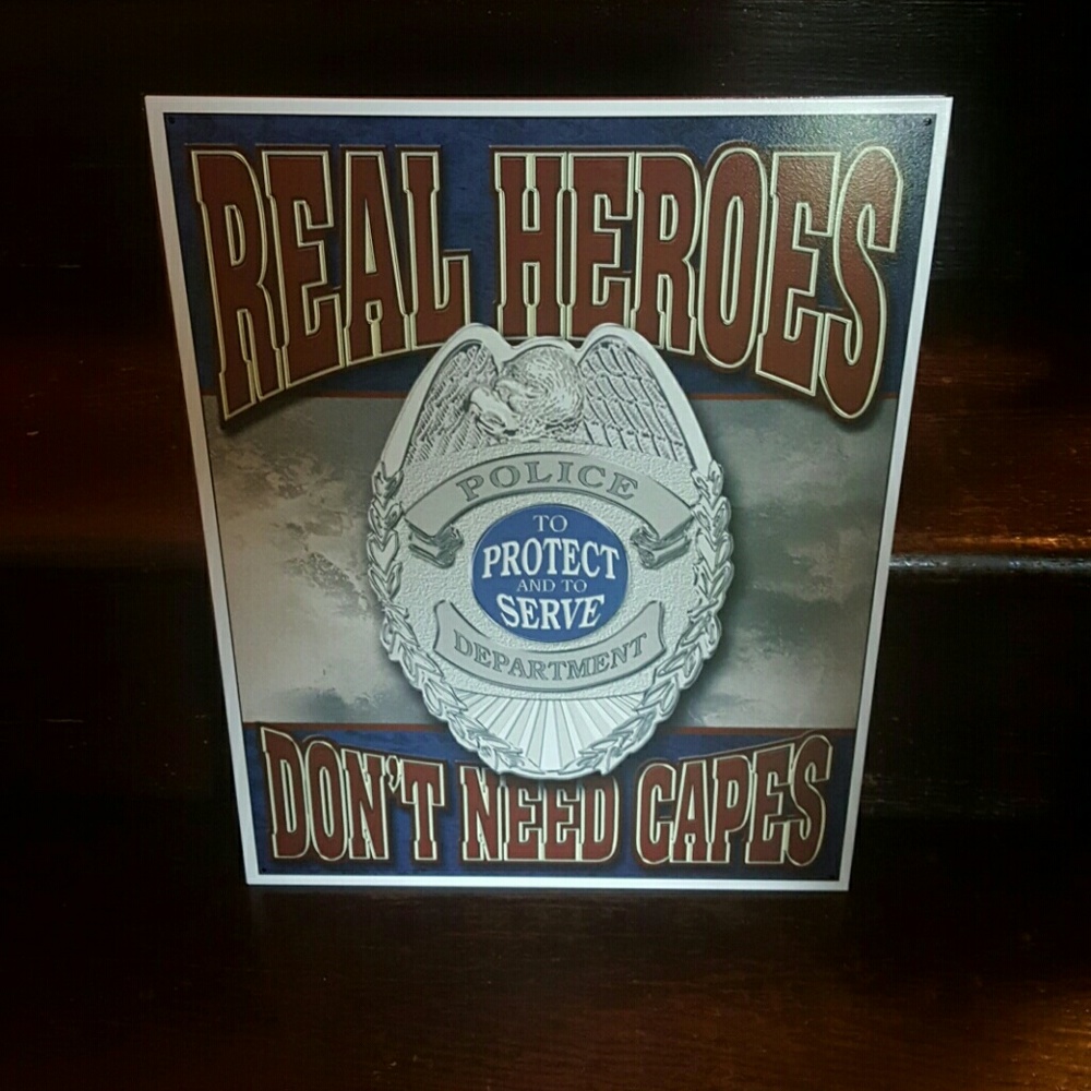 Real heroes dont need capes..police dept tin sign