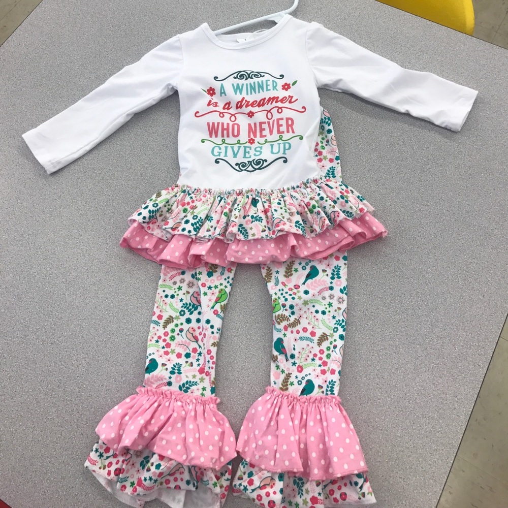 A 2 piece multi colored outfit with matching pants