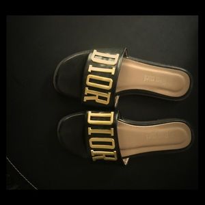 Slides with Dior detail. Not Christian Dior.