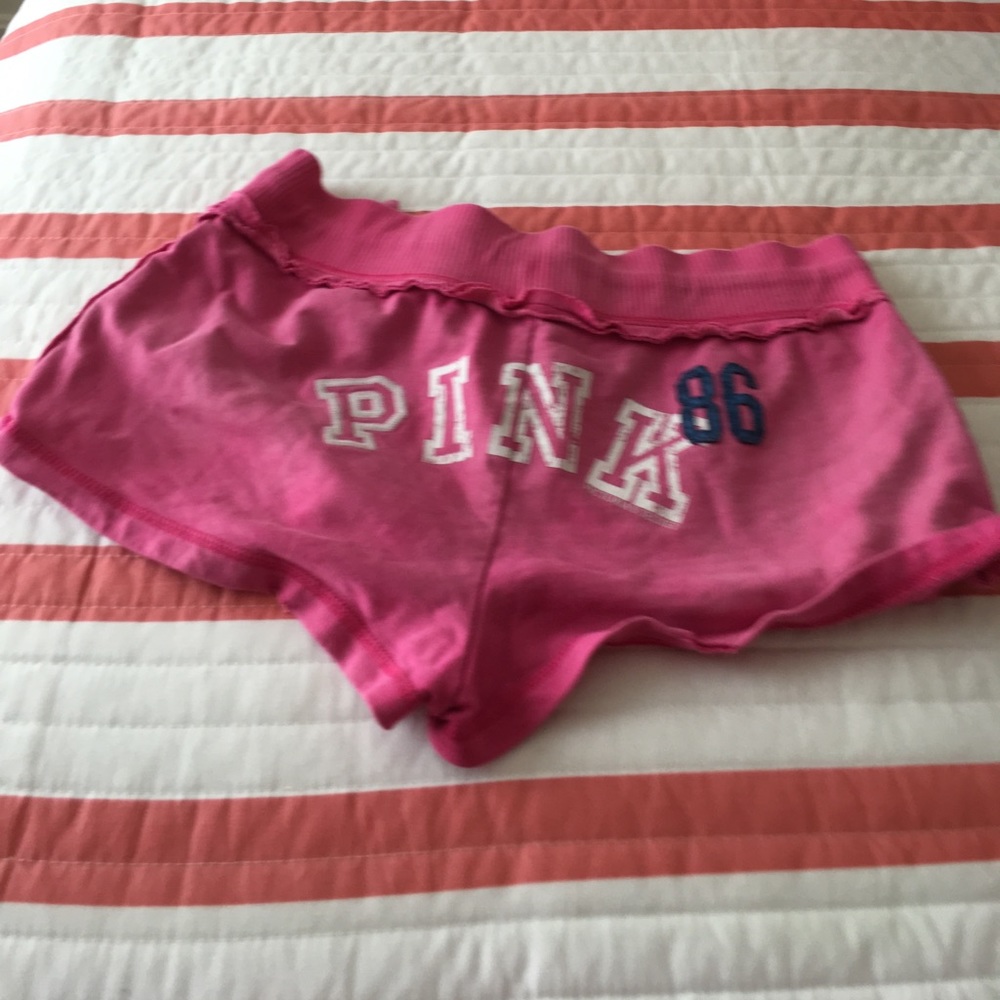 Pink distressed sweat shorts