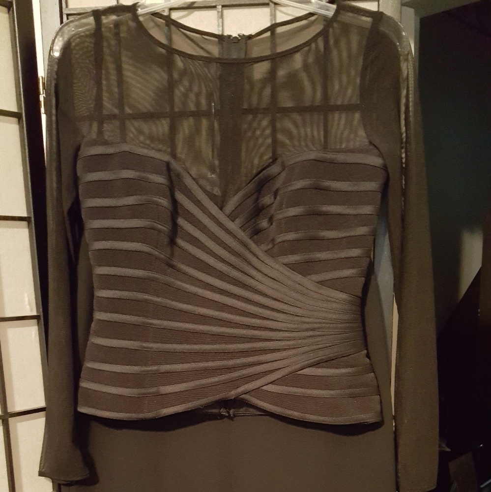 Black shear/spandex shell by JS Collection.