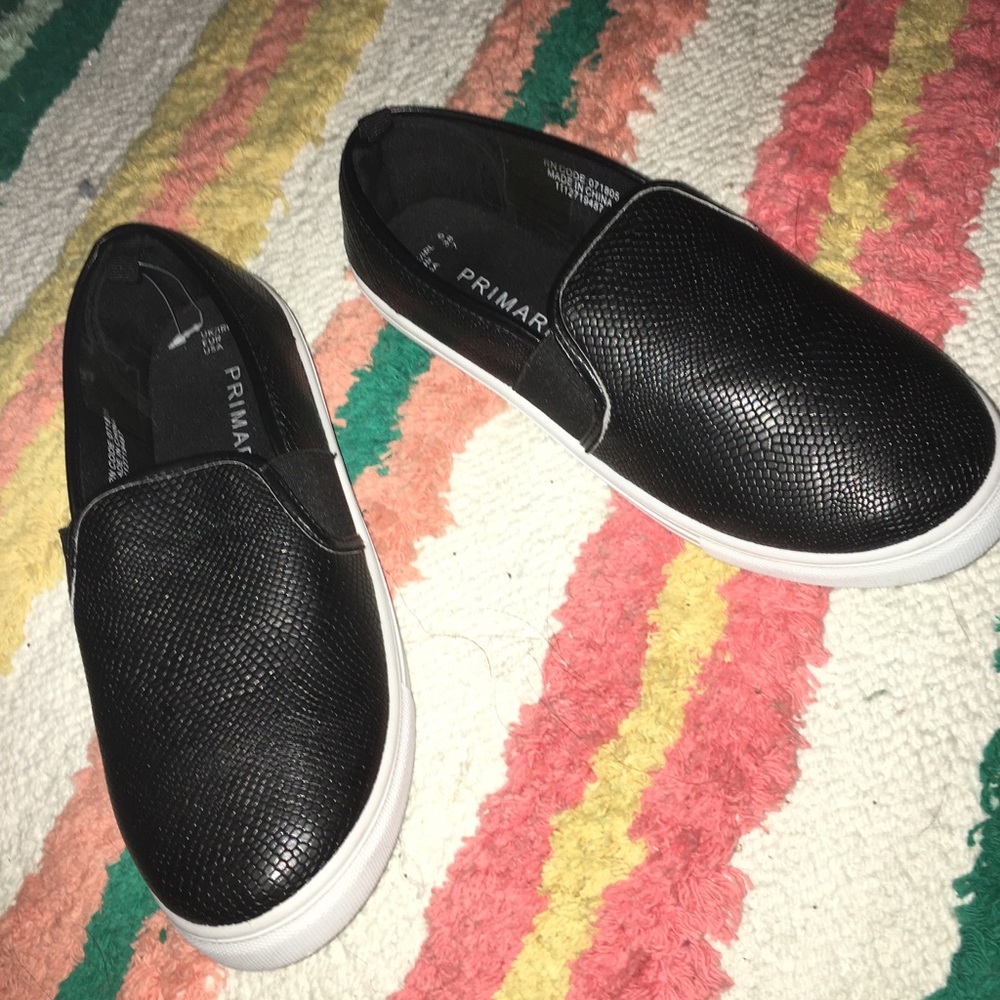 Black leather slip ons