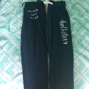 2 pairs of sweatpants. One sweatshirt