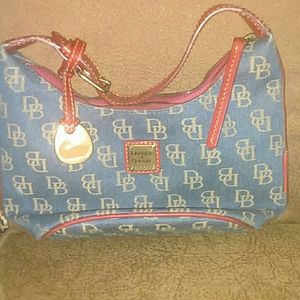 Dooney and burke with leather strap. Mostly new!