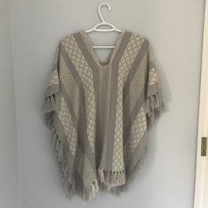 Gray and white poncho sweater