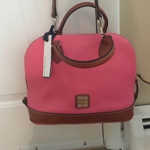 A pink NEVER USED Dooney and Bourke Bag.