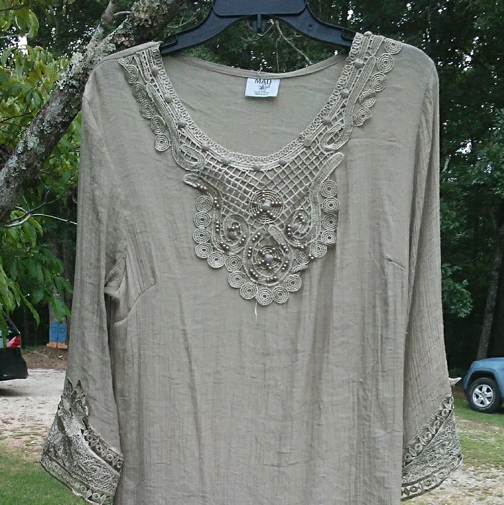 Khaki colored top with lace designs
