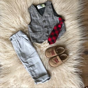 Vest with slacks, wingtip leather shoes and tie