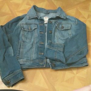 Short length button up jean jacket.