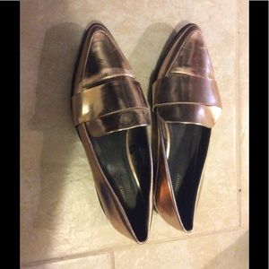 Rose gold flat pumps