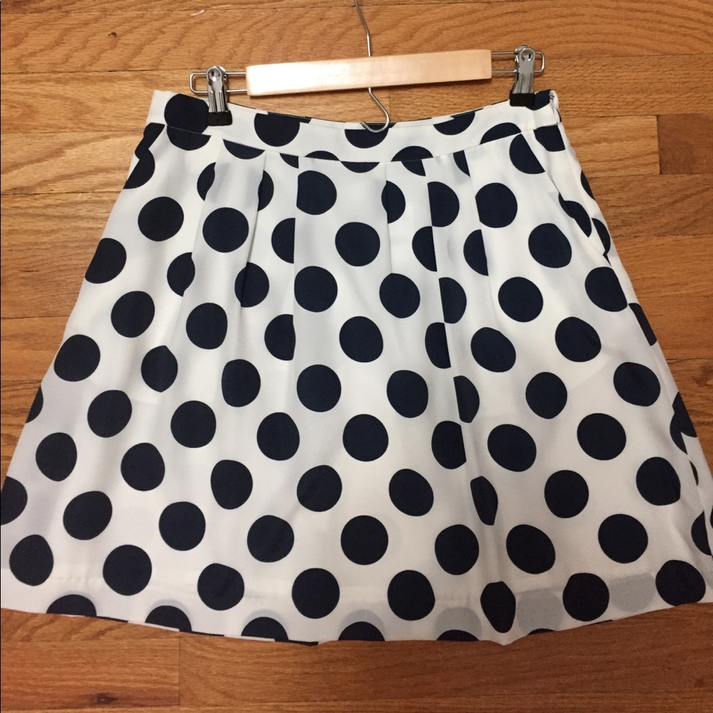 Navy polka dot pleated skirt