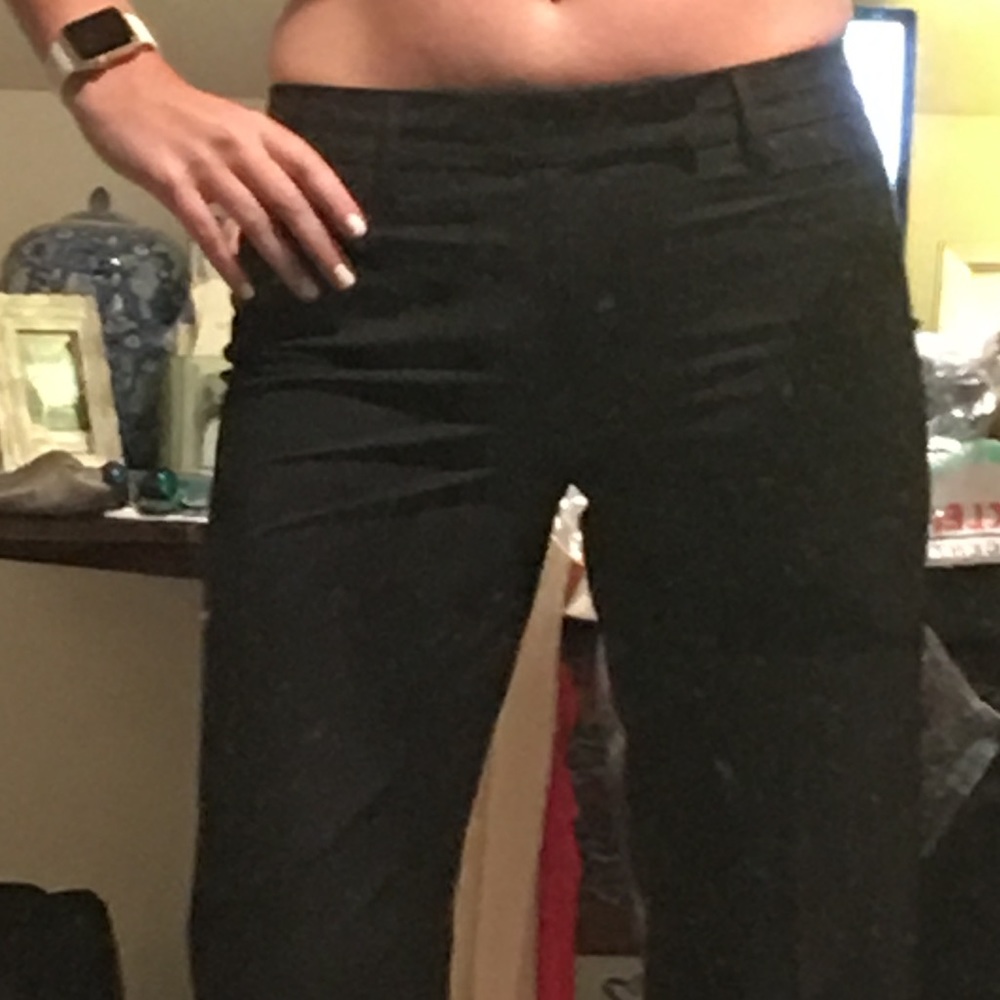 Black wide leg trousers with subtle pinstripes