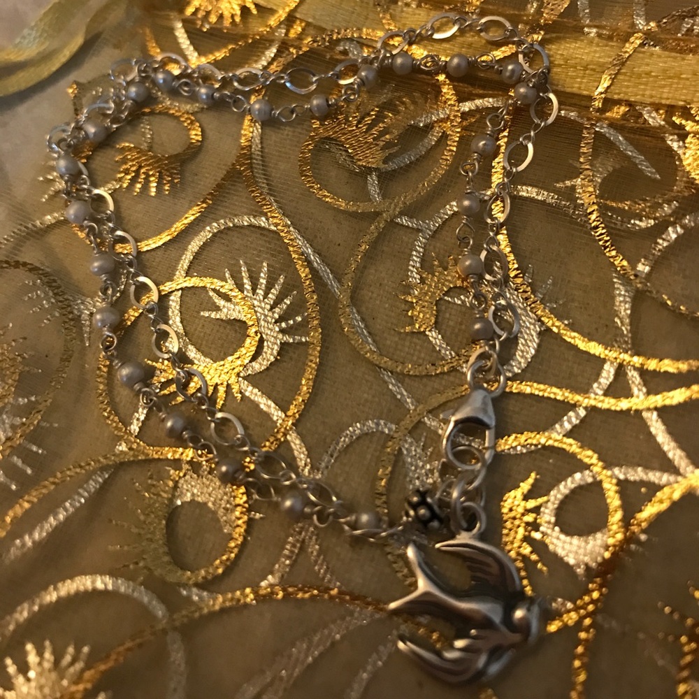 Double Strand Bracelet with Pearls and Bird Charm.