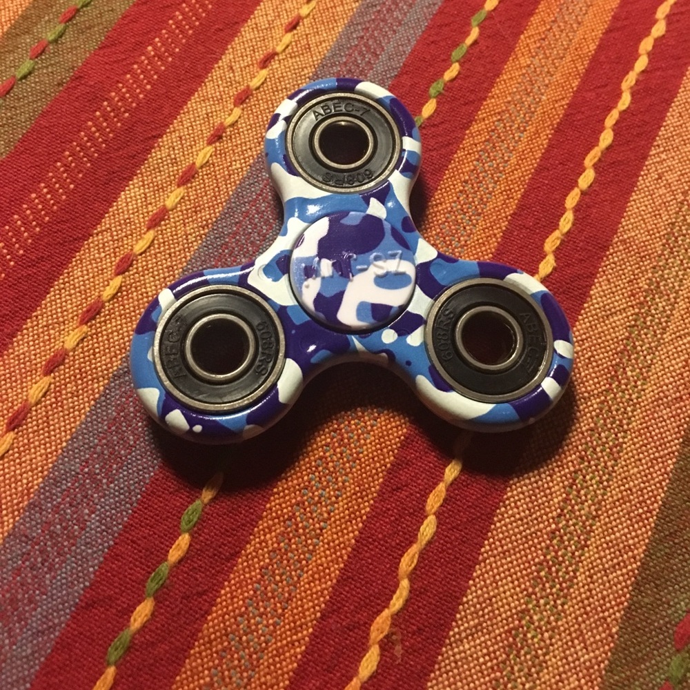 A camouflage blue and white fidget spinner
