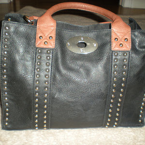 Black purse with gold studs