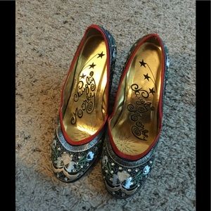 Naughty Monkey patterned wedge heels.