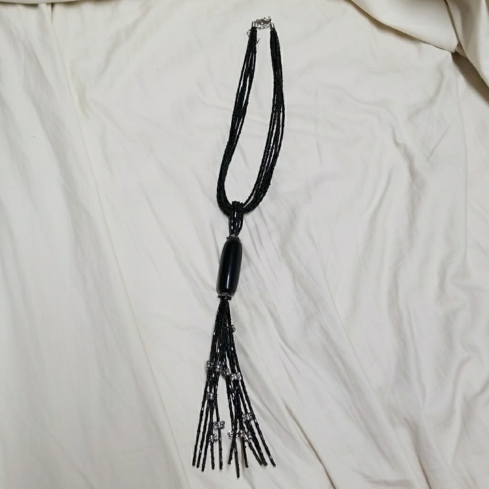 Black beaded, long lying low neckline