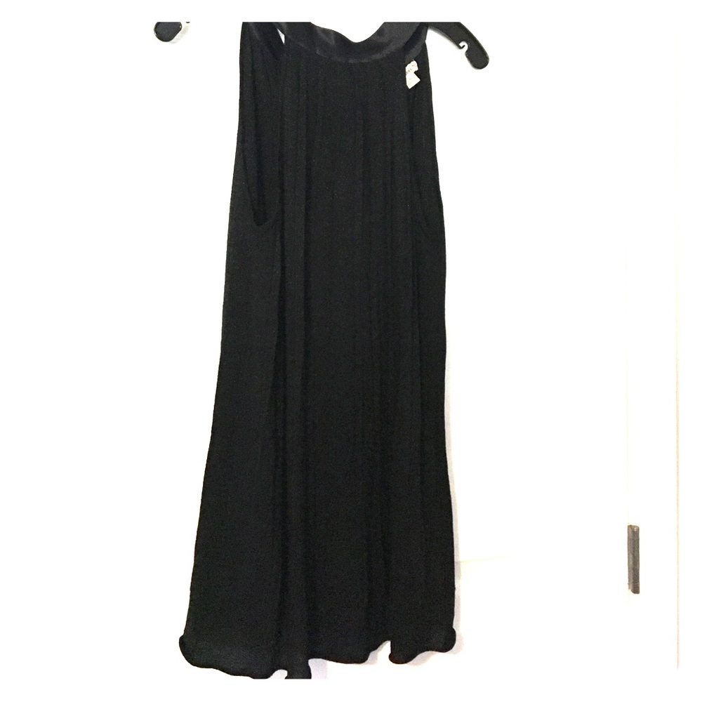 Black short sparkle trapeze dress with high neck.