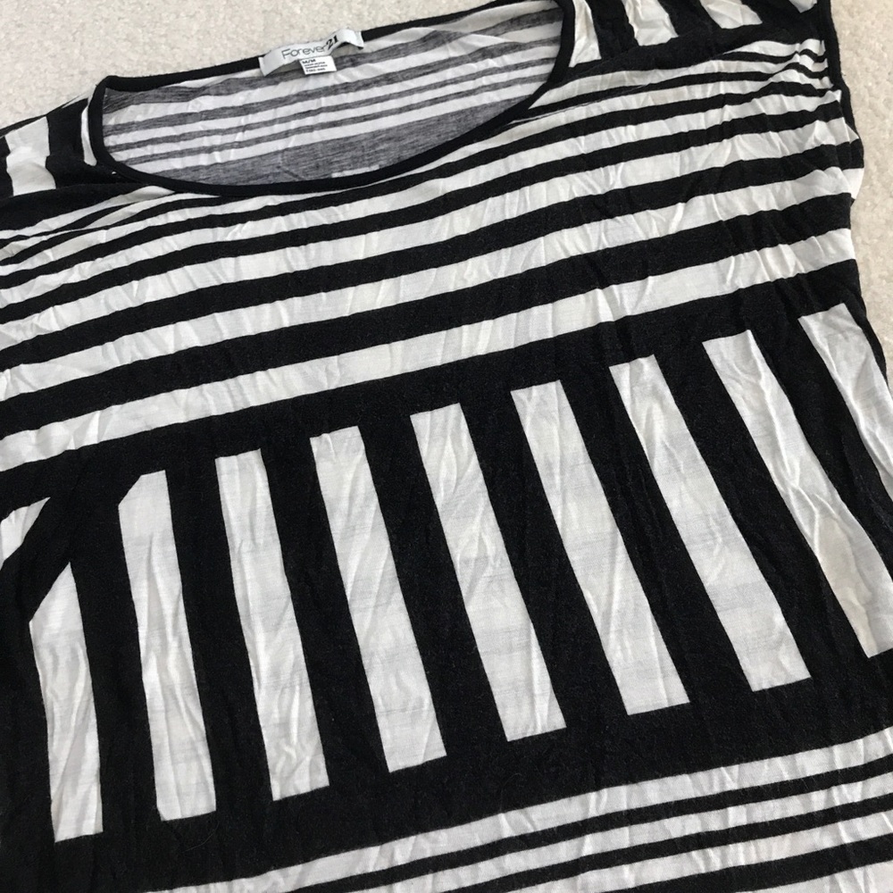 Black and cream colored top