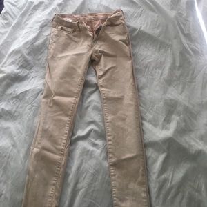 Light pink skinny jeans with a touch of glitter