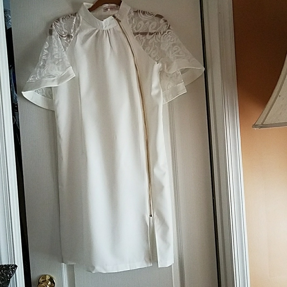 Front and back of white lace cape dress