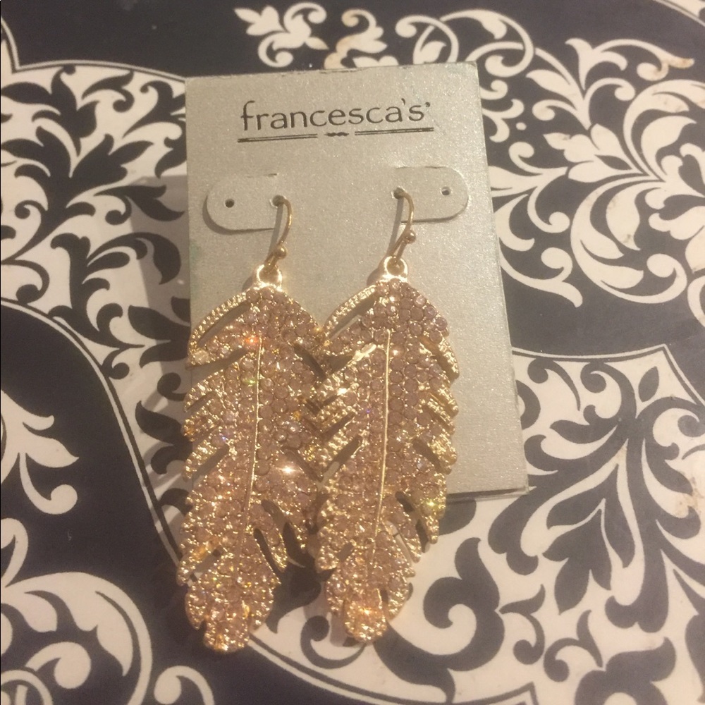 Gold feather earrings