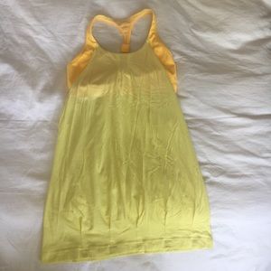 Yellow Lululemon tank with exposed & attached bra