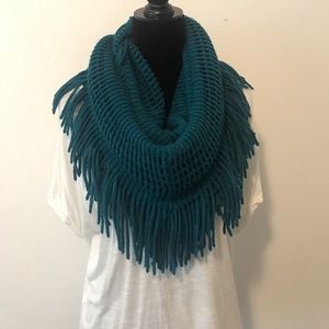 Knitted infinity scarf with tassels