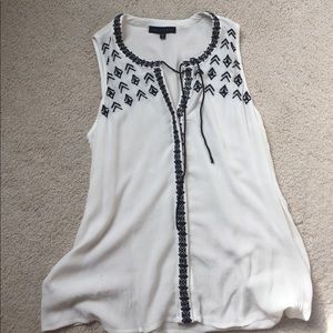 Sanctuary cream and black top.