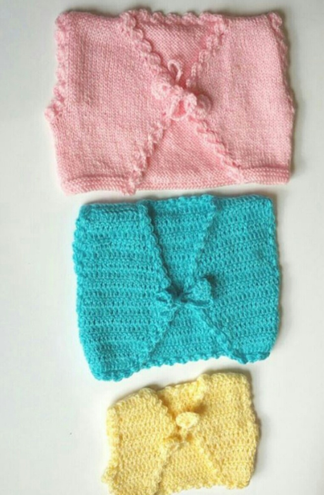 Handmade crochet baby vests!