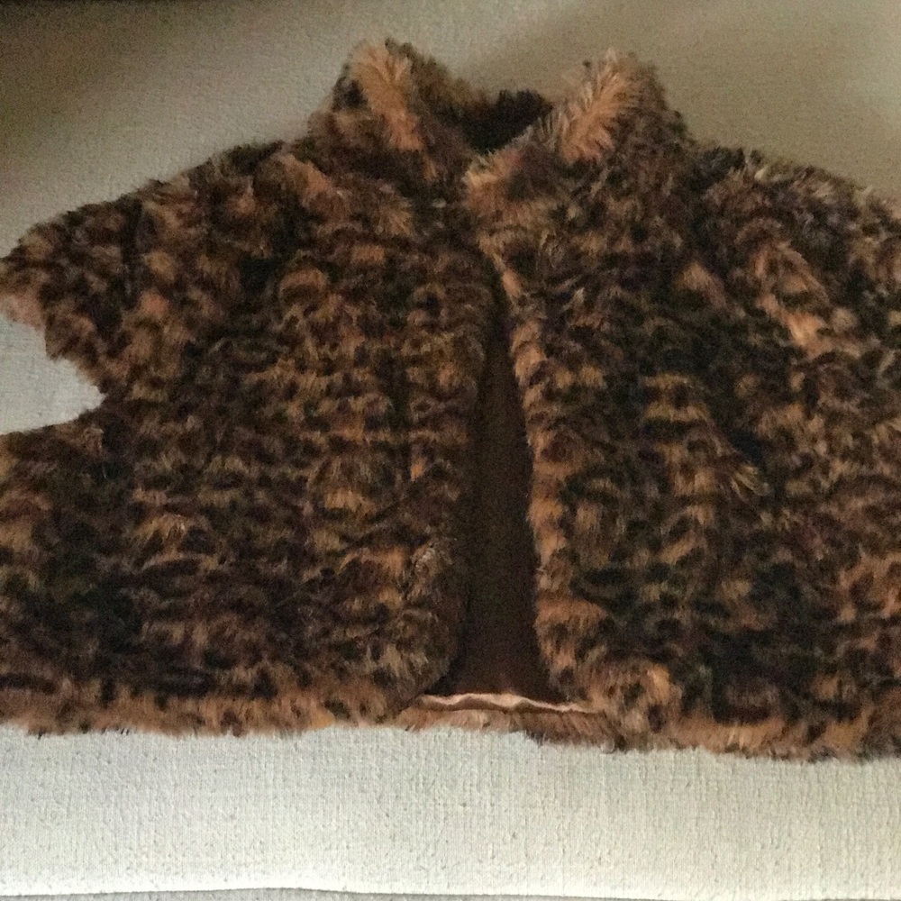 XX1 cropped animal print vest.