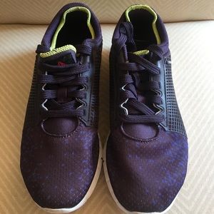 Reebok sneakers in eggplant/ purple color.