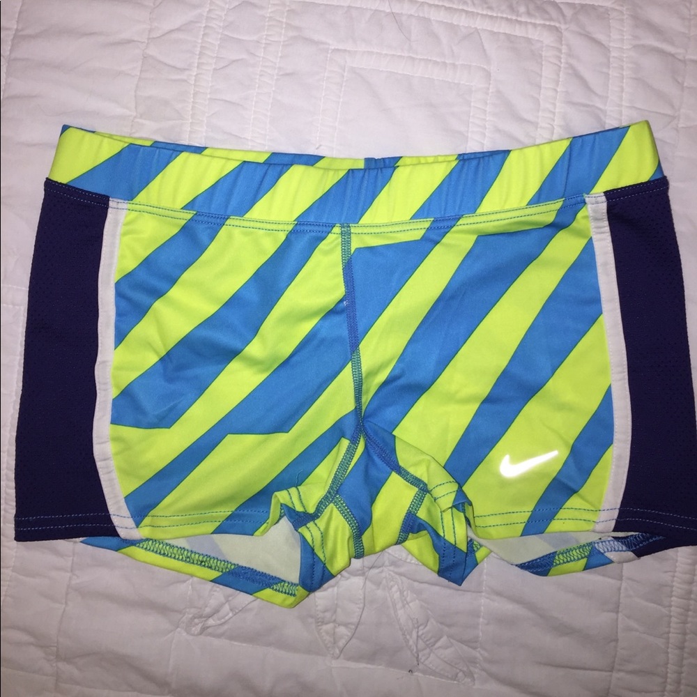 Blue and yellow striped Nike slider shorts