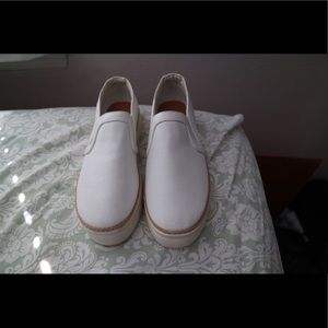 White slip on white shoes