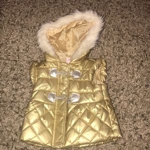 Gold baby girls vest never worn