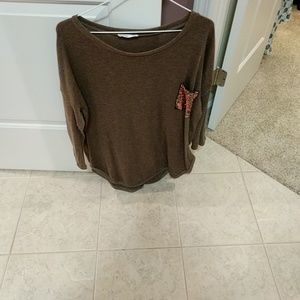 Boutique style tunic with sequin pocket