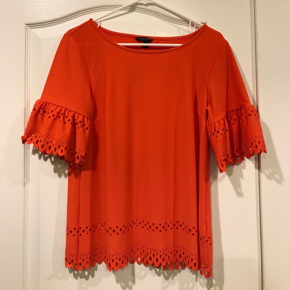 Cutout edging orange blouse