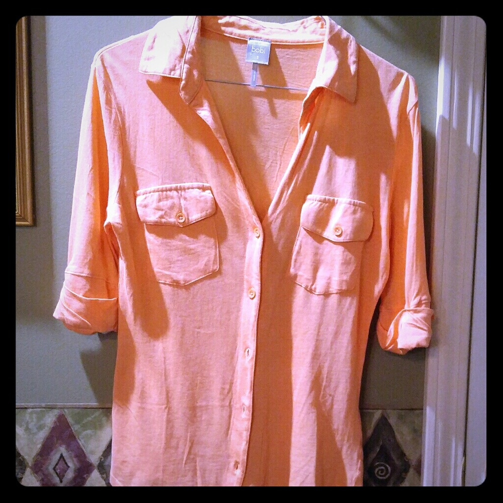 Pretty orange color top.