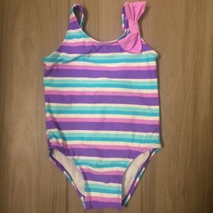 Striped bathing suit with bow accent