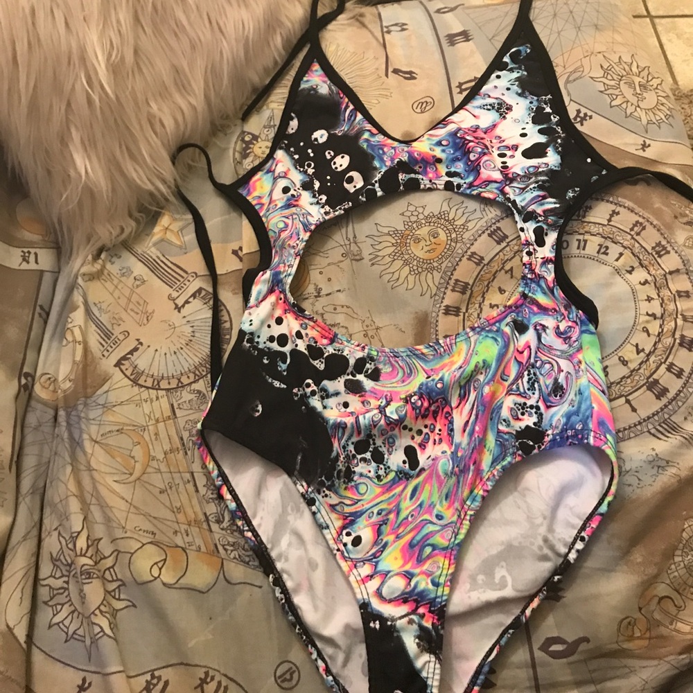 Ravewithmigente acid bath bodysuit.
