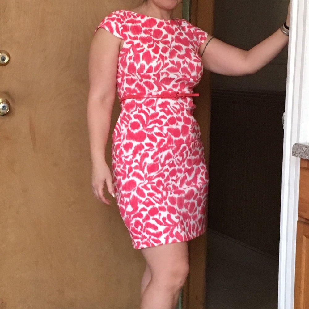 Pink and white dress with belt attached.
