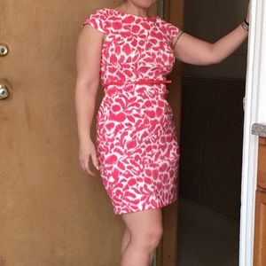 Pink and white dress with belt attached.