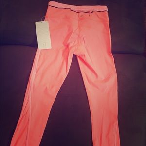 Brand new RUN:Pace Lululemon pants. Orange/Pink.