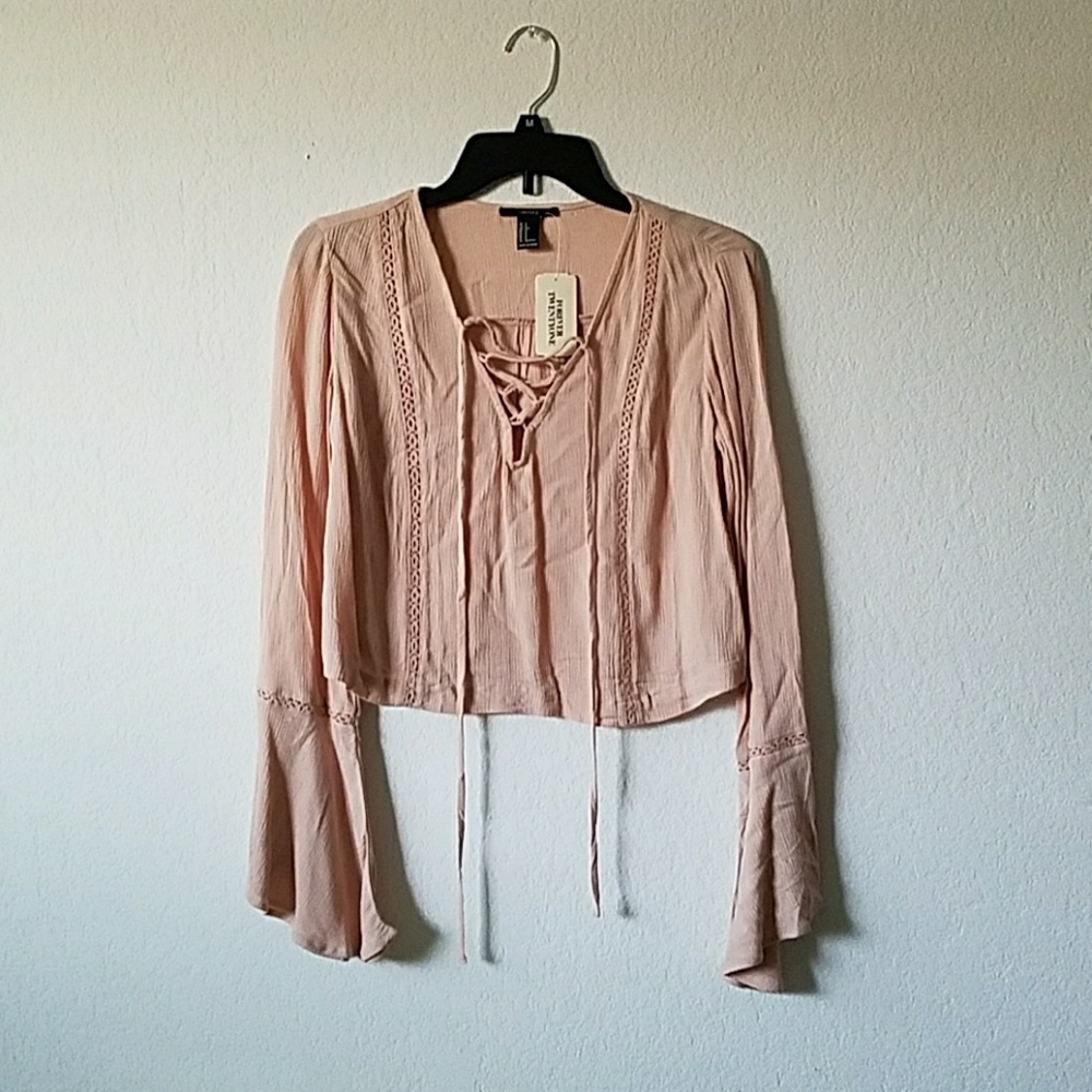 Millennial pink flare sleeve lace up top