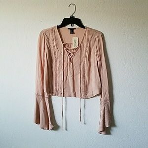 Millennial pink flare sleeve lace up top