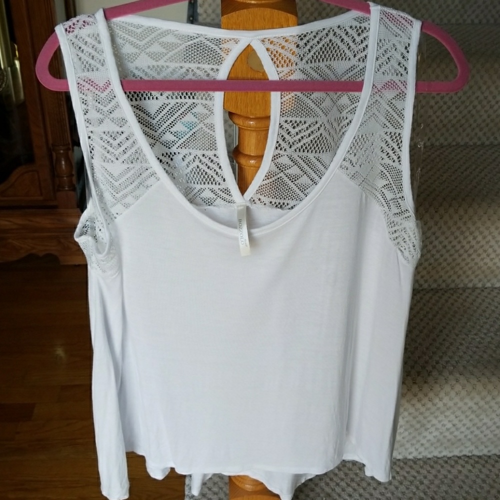 Loose white tank top with detailing on back