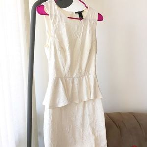 Embossed fabric peplum fit and flare dress