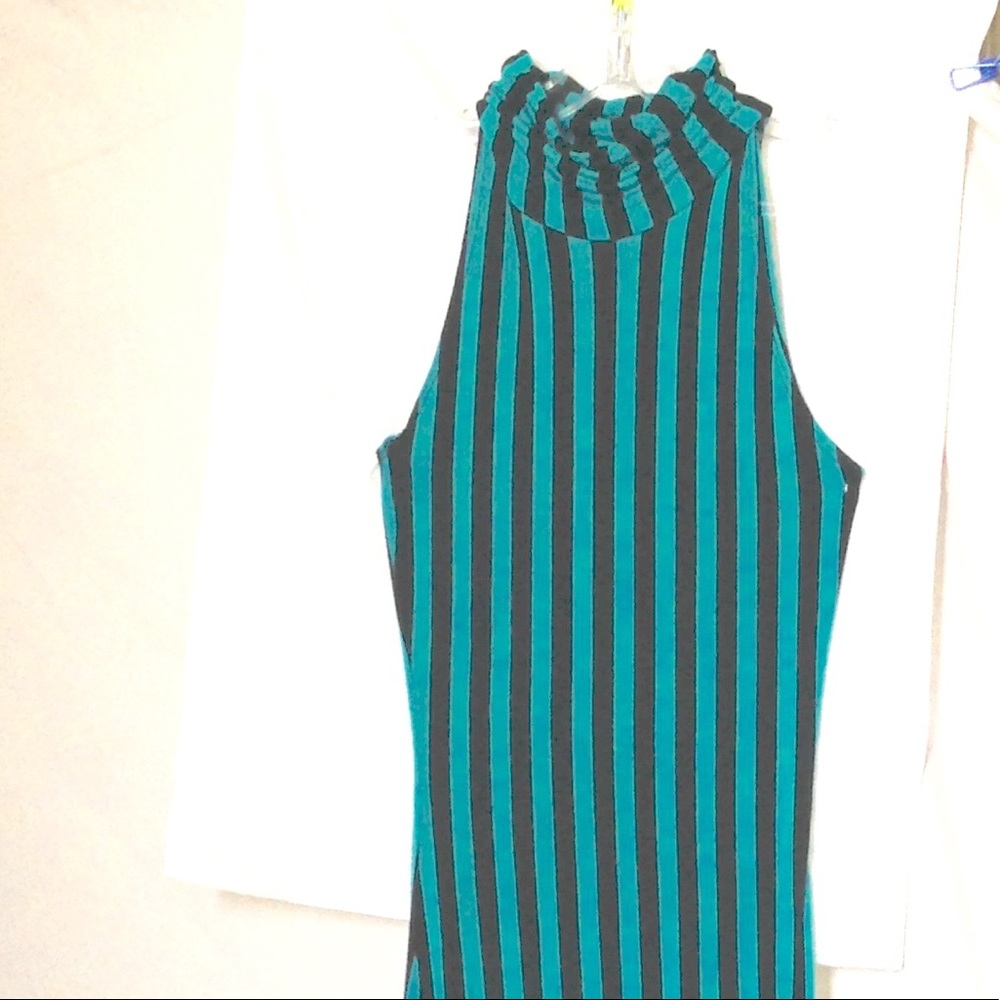 Turtle neck, sleeveless dress w/ slits on the side