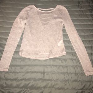 light pink sheer shirt with V shape in the back